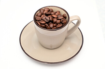 Arabic coffee beans in Turkish coffee cup.