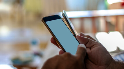 Business people using their smartphones at home. Teamwork group looking for information needed for working on the internet through mobile phones. Group of diverse hands using mobile. Close-up.