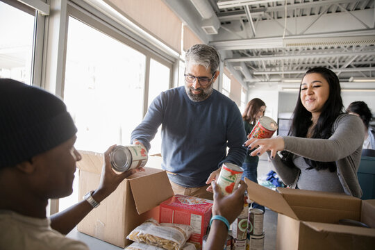 Volunteers sorting food donations in community center