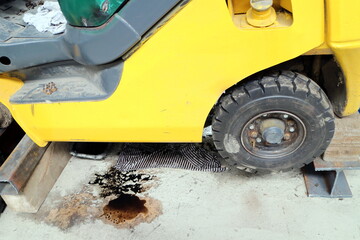 Black wheel loader in hangar