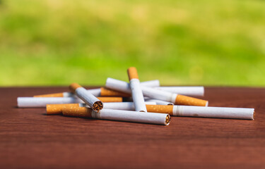 Isolated pile of cigaretts lying on a table