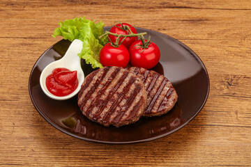 Grilled burger cutlet with sauce