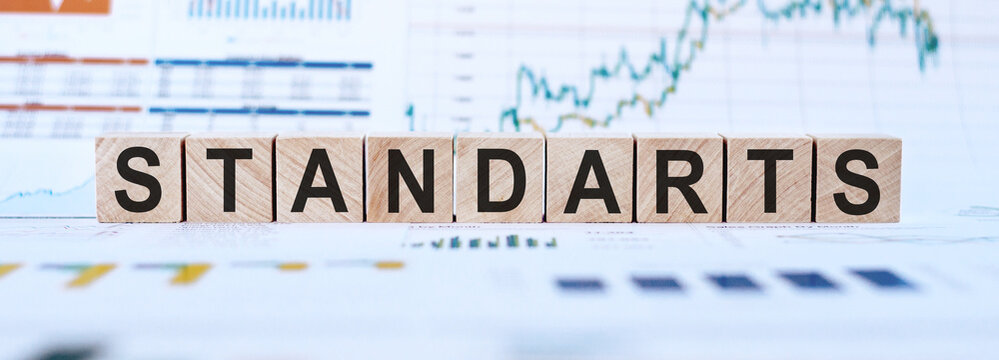 Word STANDARTS on the wooden cubes on office background