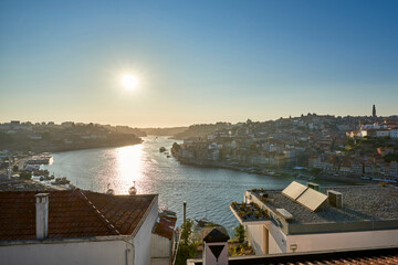 Portugal. The city of Porto. The evening sun over the Duero River and over the Ribeira quarter from...