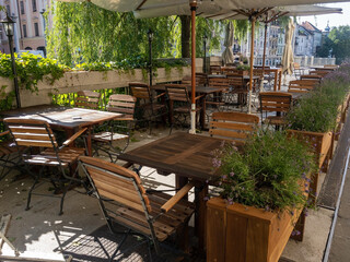 A cozy outdoor cafe in the green trees on the riverbank