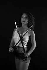 Black-white portrait of a curly girl with a bayonet-knife