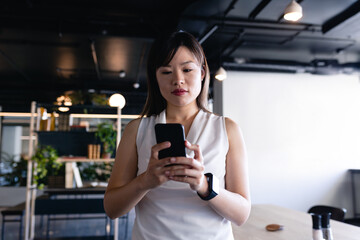 Asian woman using her phone