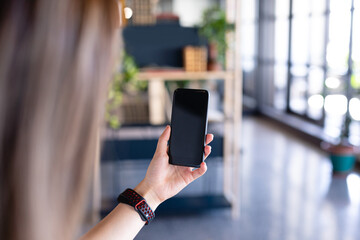 Focus on a phone holding by a woman 