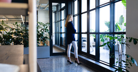  Caucasian woman looking outside 