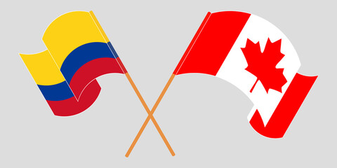 Crossed and waving flags of Colombia and Canada