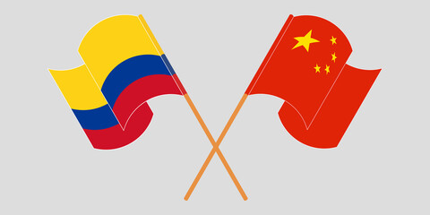 Crossed and waving flags of Colombia and China