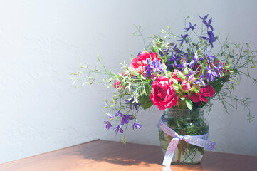  Bouquet of pink flowers in a vase. On the table. Spring and summer flowers. Still life