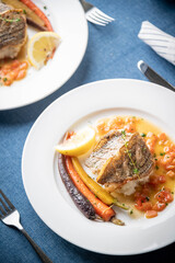 sea bass poele with white wine sauce, luxury restaurant style dish