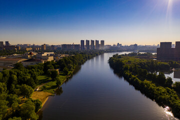 Fototapeta na wymiar panoramic view of expressway across the river taken from a drone at dawn
