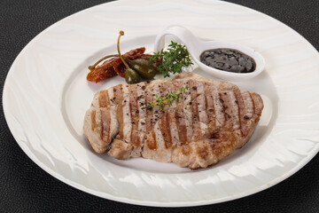 Grilled pork steak with pepper sauce