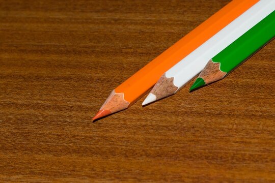 Tricolor Indian National flag is represented by three sharpened color pencils decorated on a board.