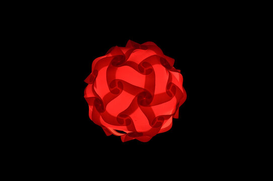 Floral red lampshade-night lamp on a pure black background