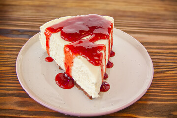 delicious cheesecake with strawberries on  plate