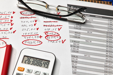 Top view of office employee's desk - work with financial reports, analysis and accounting, tables and graphs, various office items for bookkeeping
