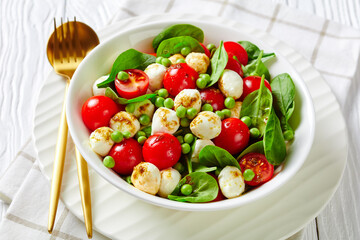 Fitness summer salad of young peas and mozzarella