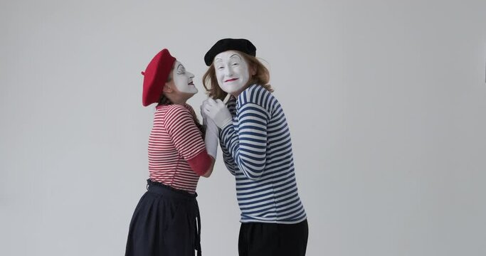 Excited mime couple running to each other feeling satisfied on meeting after long wait