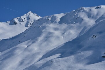Fototapeta na wymiar Valmeinier mountains in winter skiing area in the French Alps Savoie