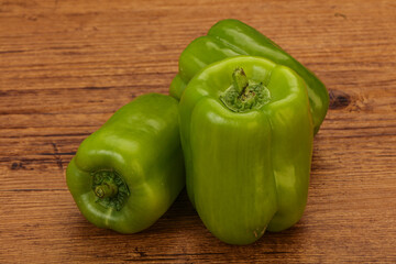 Three green bell juicy peppers
