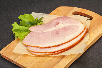 Sliced pork belly over board