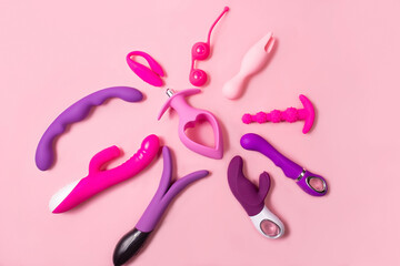 Adult toys on a pink background, sex set