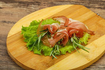 Sliced pork Jamon with rosemary