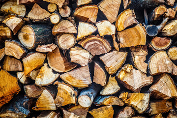 Pile of Firewood. Firewood background. Element of design. Close up view of the front of many logs prepared for the winter. Nature background. Chipped firewood. Texture