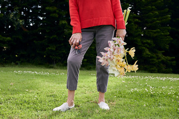 Woman in Red Sweater with Fresh Cut Flowers