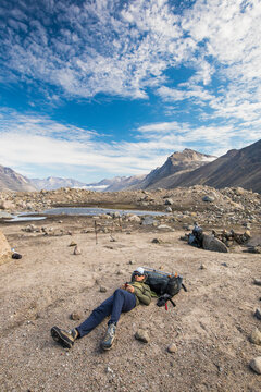 Man relaxes and uses GPS navigation device to map out his travel route