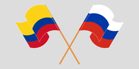 Crossed and waving flags of Colombia and Russia