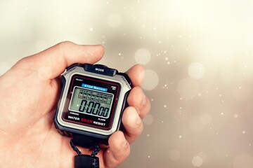 Electronic classic stopwatch in the human hand