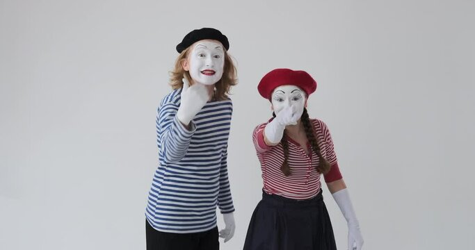 Mime artist couple inviting to come over white background