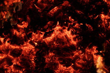Fire. A flame on a black background. A background for designers. Colors of hell. Abstract fiery texture.