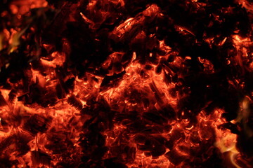 Fire. A flame on a black background. A background for designers. Colors of hell. Abstract fiery texture.