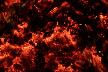 Fire. A flame on a black background. A background for designers. Colors of hell. Abstract fiery texture.