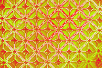 Red pearls in a yellow and gold net pattern