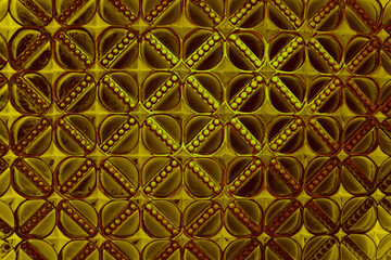 Burgundy net pattern accentuated by a net of gold