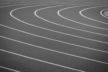 Empty track at a large stadium. Black and white horizontal background