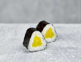two slices of mini sushi roll maki with takuan © Максим Логвинов