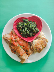 pancakes spinach and fish dish with heart shaped plate