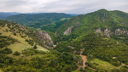 Fototapeta na wymiar Aerial shot drone image on mountains with rocks and trees and Timok river around - Baranica near Knjazevac in eastern Serbia on Balkans - nature background no people in summer day