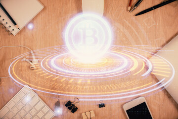 Double exposure of blockchain theme hologram over table with phone. Top view. Crypto technology...