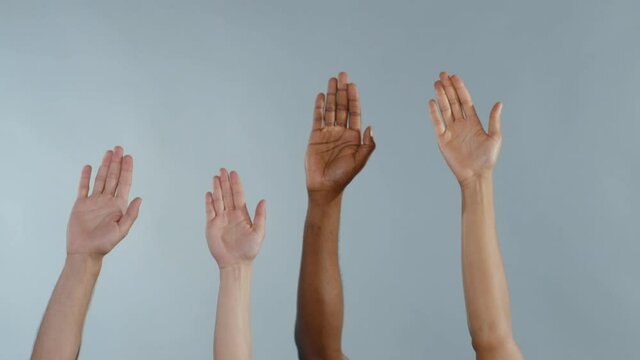 Multi-ethnic Hands of Diverse People Holding Up Isolated on Grey Background. Racial Equality. Ethnic Diversity. Human Rights. Freedom Concept.