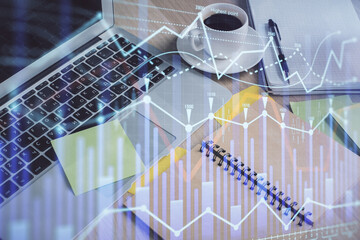 Multi exposure of forex graph drawing and desktop with coffee and items on table background. Concept of financial market trading