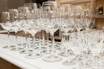 Wine glasses in a row at the bar