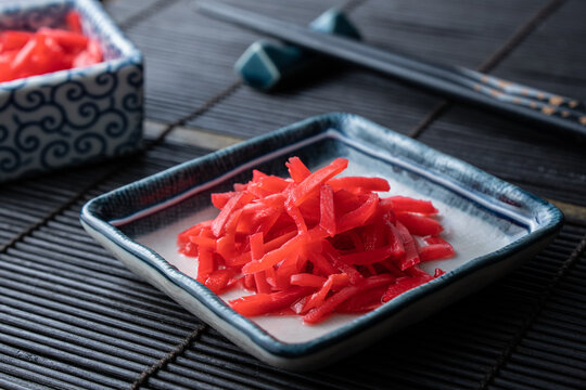 Benishoga, a type of Japanese pickled ginger often used as a side dish next to yakisoba, ramen, and other traditional dishes.